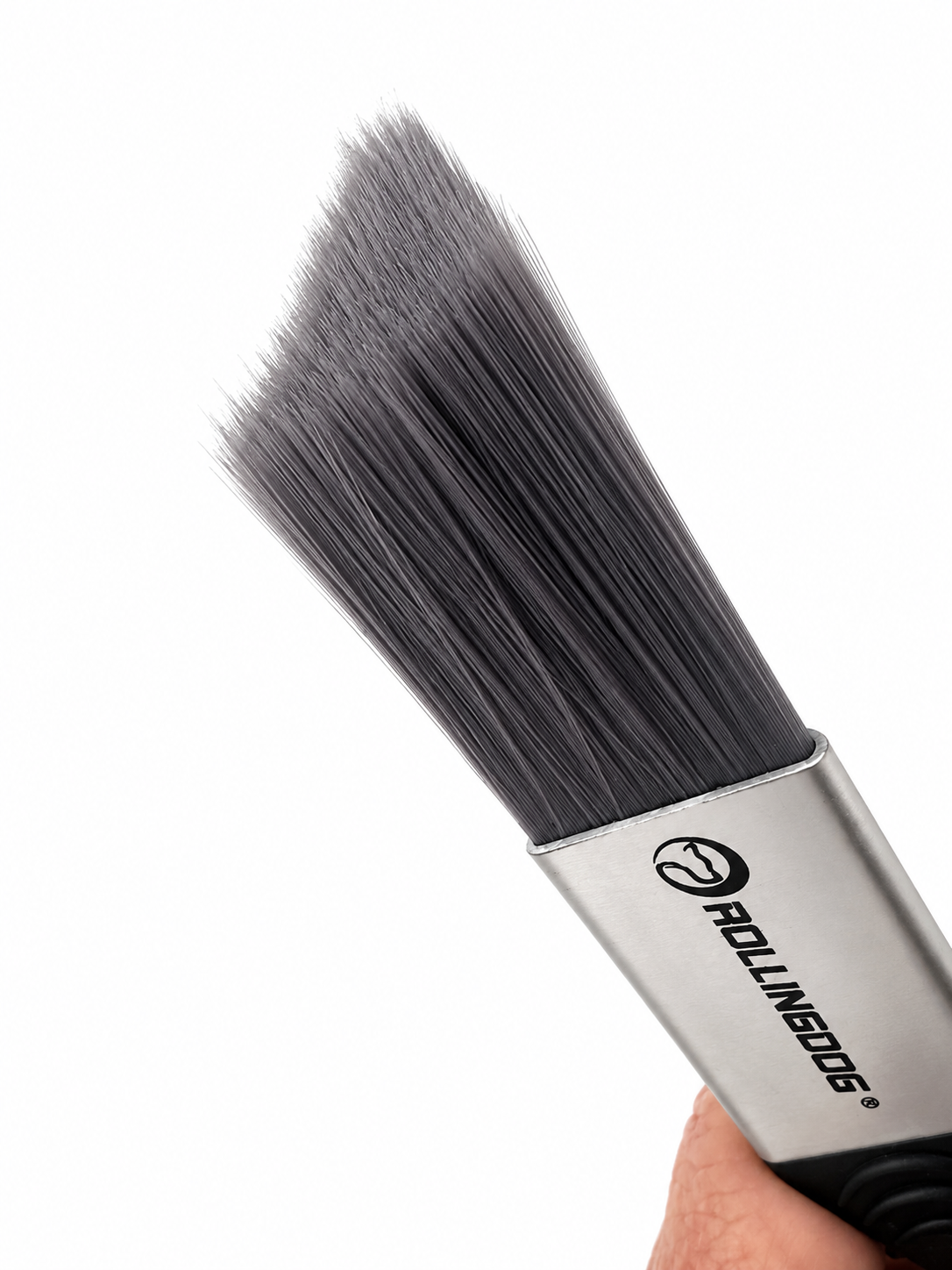 Brush with black bristles and silver ferrule on a white background. Triangle shaped
